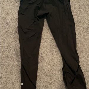 Black size 4 lululemon leggings with flower and velvet stripe design